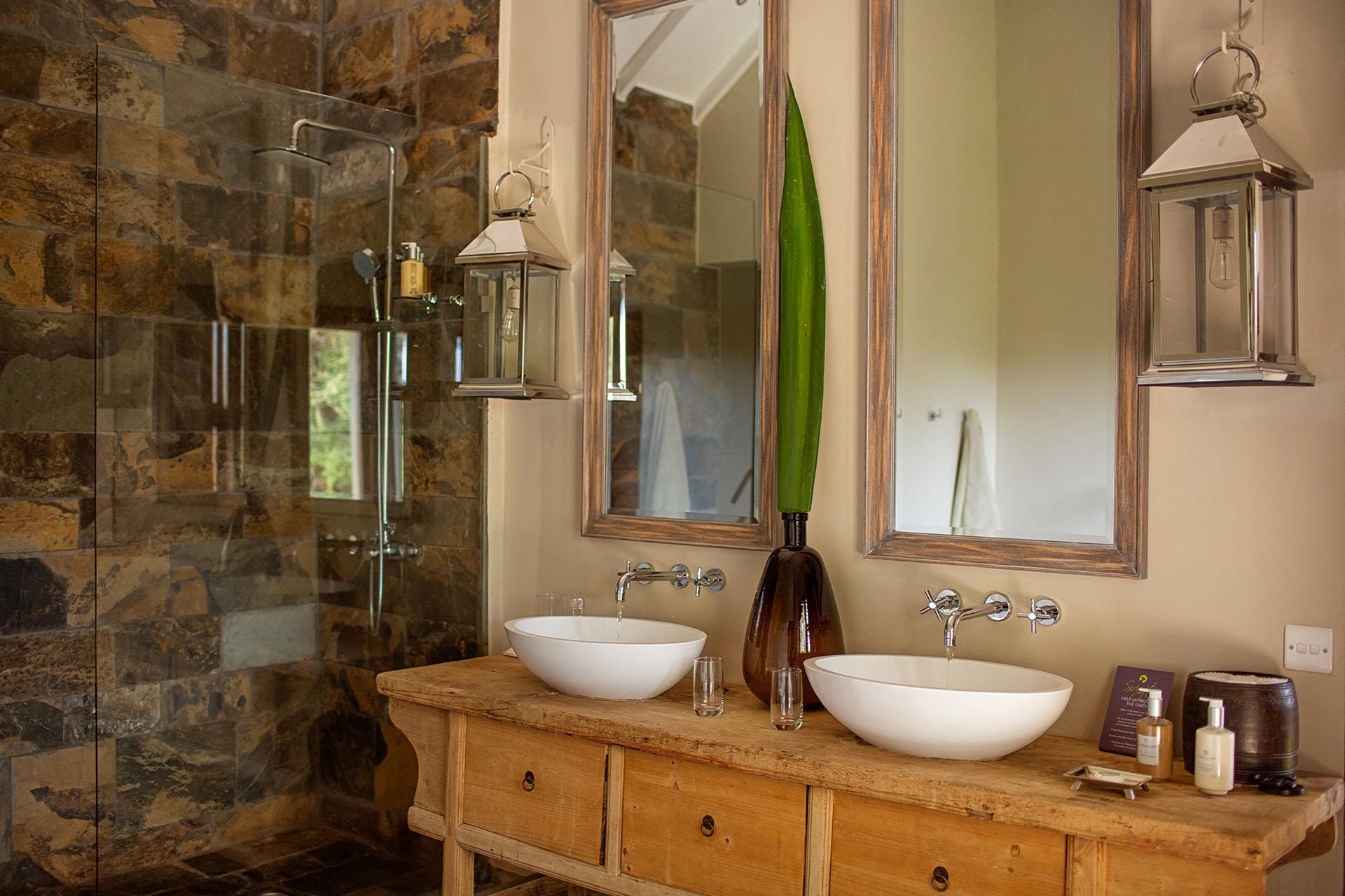 The en-suite bathrooms are spacious, with a bathtub to fill with bubbles lit by candlelight, and steaming hot showers heated by solar heaters. His and her sinks designed for ultimate ease and comfort. The en-suite bathrooms are spacious, with a bathtub to fill with bubbles lit by candlelight, and steaming hot showers heated by solar heaters. His and her sinks designed for ultimate ease and comfort.