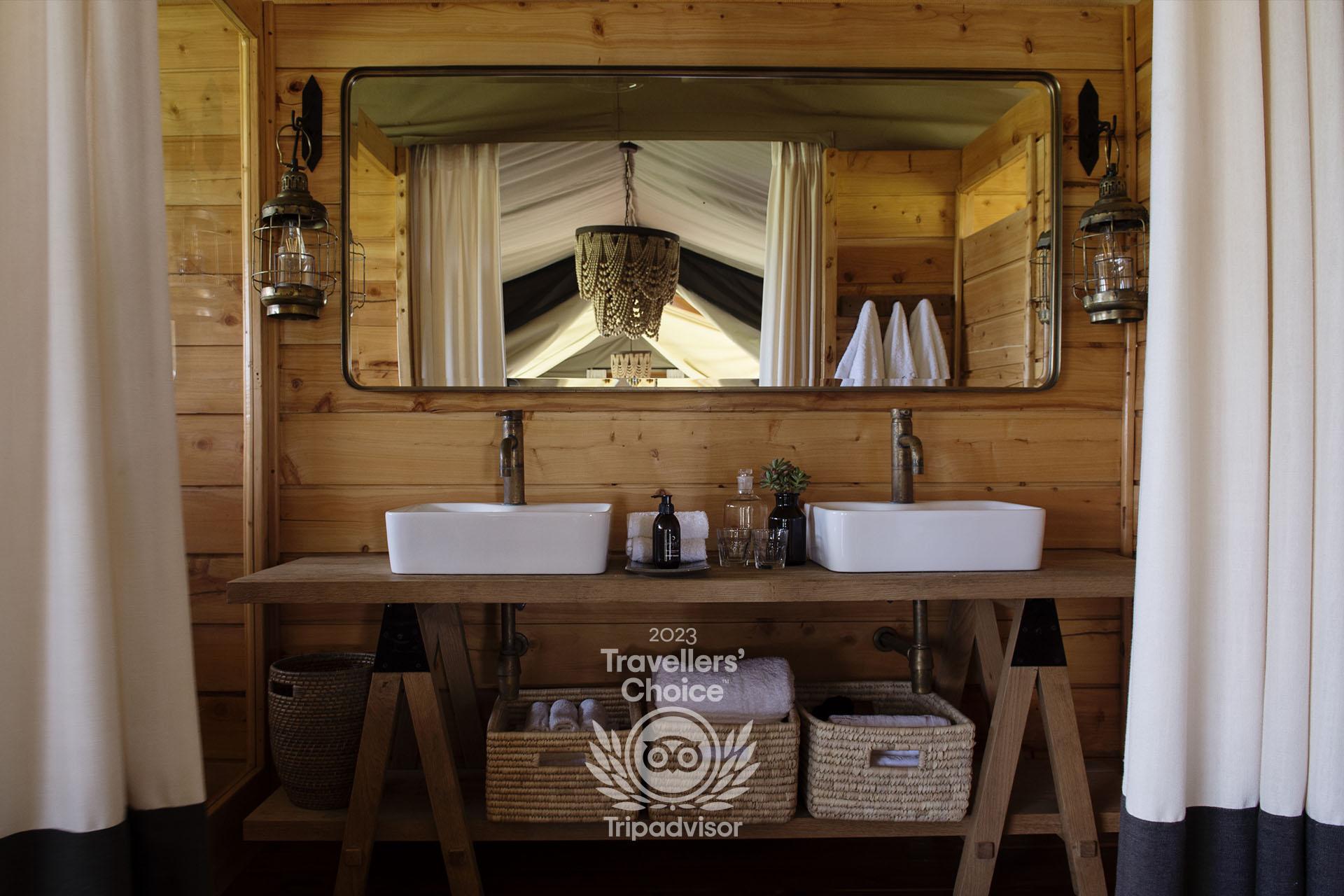 An ensuite bathroom with “his and hers” wash hand basins, large shower and proper flush toilet complete each guest tent
